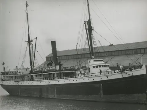 An old photograph of the wooden steamship Portland at anchor in Elliott Bay.